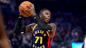Jan 31, 2025; San Francisco, California, USA; Golden State Warriors guard Dennis Schroder (71) holds onto a rebound against the Phoenix Suns in the first quarter at the Chase Center. Mandatory Credit: Cary Edmondson-Imagn Images