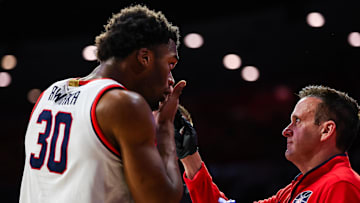 Jan 14, 2025; Tucson, Arizona, USA; Arizona Wildcats athletic trainer Justin Kokoski helps Arizona Wildcats forward Tobe Awaka (30) put his contact back into his eye during the second half of the game at McKale Center. Mandatory Credit: Aryanna Frank-Imagn Images