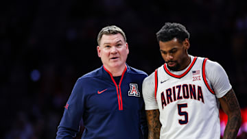 Jan 11, 2025; Tucson, Arizona, USA; Arizona Wildcats head coach Tommy Lloyd talks with guard KJ Lewis (5) during the first half against the UCF Knights at McKale Center. Mandatory Credit: Aryanna Frank-Imagn Images