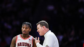 Feb 26, 2025; Tucson, Arizona, USA; Arizona Wildcats head coach Tommy Lloyd talks with guard Jaden Bradley (0) during the second half against the Utah Utes at McKale Center. Mandatory Credit: Aryanna Frank-Imagn Images