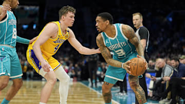Jan 27, 2025; Charlotte, North Carolina, USA; Charlotte Hornets guard DaQuan Jeffries (3) handles the ball against Los Angeles Lakers guard Dalton Knecht (4) during the second half at the Spectrum Center. Mandatory Credit: Jim Dedmon-Imagn Images