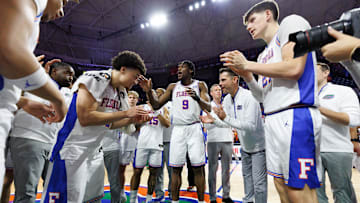Mar 8, 2025; Gainesville, Florida, USA; Florida Gators guard Walter Clayton Jr. (1), Florida Gators center Rueben Chinyelu (9) and Florida Gators head coach Todd Golden clap after a game against the Mississippi Rebels at Exactech Arena at the Stephen C. O'Connell Center. Mandatory Credit: Matt Pendleton-Imagn Images
