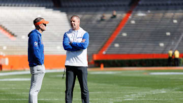 Apr 12, 2025; Gainesville, FL, USA; Florida Gators athletic director Scott Stricklin and Florida Gators head coach Billy Napier talk before the game at Ben Hill Griffin Stadium. Mandatory Credit: Matt Pendleton-Imagn Images
