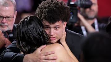 Jun 25, 2025; Brooklyn, NY, USA;  Walter Clayton Jr. celebrates with family after being selected as the 18th pick by the Washington Wizards in the first round of the 2025 NBA Draft at Barclays Center. Mandatory Credit: Brad Penner-Imagn Images