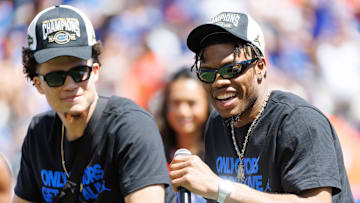 Apr 12, 2025; Gainesville, FL, USA; Florida Gators guard Alijah Martin (15) smiles while Florida Gators guard Walter Clayton Jr. (1) listens during the National Championship celebration at Ben Hill Griffin Stadium. Mandatory Credit: Matt Pendleton-Imagn Images