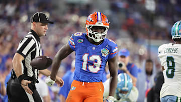 Dec 20, 2024; Tampa, FL, USA; Florida Gators running back Jadan Baugh (13) celebrates after he runs with the ball during the second half at Raymond James Stadium. Mandatory Credit: Kim Klement Neitzel-Imagn Images