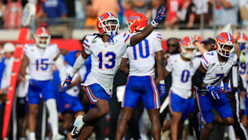 Florida Gators defensive back Aaron Gates (13) celebrates his interception during the second quarter of an NCAA college football matchup Saturday, Nov. 2, 2024 at EverBank Stadium in Jacksonville, Fla. The Georgia Bulldogs defeated the Florida Gators 34-20. [Corey Perrine/Florida Times-Union]