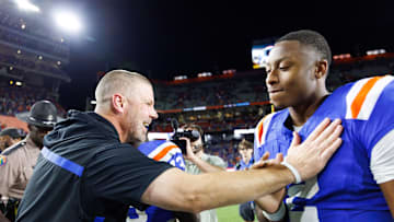 Oct 18, 2025; Gainesville, Florida, USA; Florida Gators head coach Billy Napier celebrates with quarterback DJ Lagway (2) after a game against the Mississippi State Bulldogs at Ben Hill Griffin Stadium. Mandatory Credit: Matt Pendleton-Imagn Images