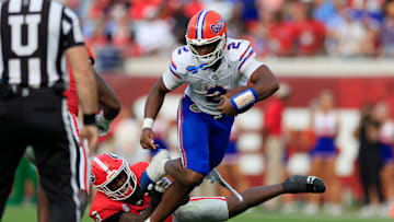 Florida Gators quarterback DJ Lagway (2) rushes for yards against Georgia Bulldogs linebacker CJ Allen (3) during the second quarter of an NCAA college football matchup Saturday, Nov. 2, 2024 at EverBank Stadium in Jacksonville, Fla. The Georgia Bulldogs defeated the Florida Gators 34-20. [Corey Perrine/Florida Times-Union]