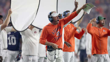 Sep 6, 2025; Auburn, Alabama, USA;  Auburn Tigers head coach Hugh Freeze signals a play during the fourth quarter against the Ball State Cardinals at Jordan-Hare Stadium. Mandatory Credit: John Reed-Imagn Images