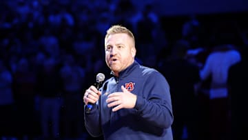 Dec 3, 2025; Auburn, Alabama, USA; Auburn Tigers head football coach Alex Golesh is introduced during the first half of a basketball game between the Auburn Tigers and NC State Wolfpack at Neville Arena. Mandatory Credit: John Reed-Imagn Images