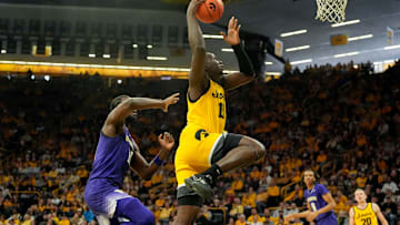 Iowa Hawkeyes forward Ladji Dembele (13) drives to the basket against the Washington Huskies Saturday, Feb. 22, 2025 at Carver-Hawkeye Arenain Iowa City, Iowa.