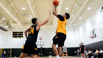 Iowa’s Kael Combs (11) shoots over Tate Sage (24) during practice June 19, 2025 at Carver-Hawkeye Arena in Iowa City, Iowa.