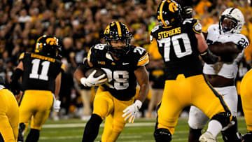 Iowa Hawkeyes running back Kamari Moulton (28) carries the ball during a college football game against the Penn State Nittany Lions Oct. 18, 2025 at Kinnick Stadium in Iowa City, Iowa.