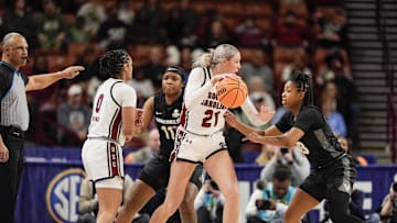 Mar 7, 2025; Greenville, SC, USA; South Carolina Gamecocks forward Chloe Kitts (21) handles the ball against Vanderbilt Commodores guard Justine Pissott (13) at Bon Secours Wellness Arena. Mandatory Credit: Jim Dedmon-Imagn Images
