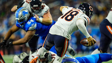 Chicago Bears quarterback Caleb Williams (18) is sacked Detroit Lions defensive tackle DJ Reader (98) in the fourth quarter on Thanksgiving Day at Ford Field in Detroit on Thursday, Nov. 28, 2024.