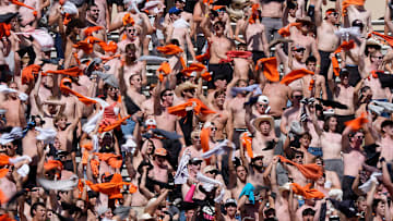 Oklahoma State fans cheer with their shirts off during a college football game between the Oklahoma State Cowboys (OSU) and the Houston Cougars at Boone Pickens Stadium in Stillwater, Okla., Saturday, Oct. 11, 2025. Houston won 39-17.
