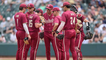 May 25, 2024; Charlotte, NC, USA; Florida State head coach Link Jarrett relieves Florida State pitcher Connor Hults (15) in the sixth inning against Wake Forest during the ACC Baseball Tournament at Truist Field. Mandatory Credit: Cory Knowlton-USA TODAY Sports