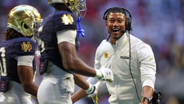 Oct 19, 2024; Atlanta, Georgia, USA; Notre Dame Fighting Irish head coach Marcus Freeman celebrates after a touchdown against the Georgia Tech Yellow Jackets in the third quarter at Mercedes-Benz Stadium. Mandatory Credit: Brett Davis-Imagn Images