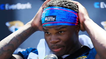 Jacksonville Jaguars wide receiver Travis Hunter (12) adjusts his headband before speaking to members of the media during the second mandatory minicamp at Miller Electric Center Wednesday, June 11, 2025 in Jacksonville, Fla.