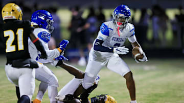 Riverside's Tae’shaun Gelsey (2) fends off Ed White's Jacquari Parks (7) but just shy of a first down turning it over on downs during the third quarter of a high school football matchup Friday, Oct. 25, 2024 at Ed White High School in Jacksonville, Fla. Ed White edged Riverside 21-20 and captured the District 4-4A title and automatic playoff berth. [Corey Perrine/Florida Times-Union]