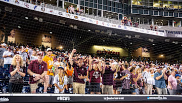 Jun 22, 2024; Omaha, NE, USA; Texas A&M Aggies fans celebrate after defeating the Tennessee Volunteers at Charles Schwab Field Omaha. Mandatory Credit: Dylan Widger-USA TODAY Sports