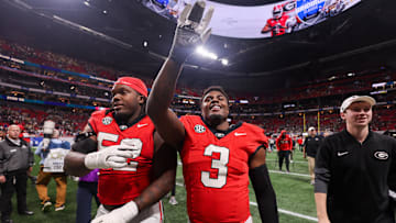 Nov 28, 2025; Atlanta, Georgia, USA; Georgia Bulldogs defensive lineman Christen Miller (52) and linebacker CJ Allen (3) celebrate after a victory over the Georgia Tech Yellow Jackets at Mercedes-Benz Stadium. Mandatory Credit: Brett Davis-Imagn Images
