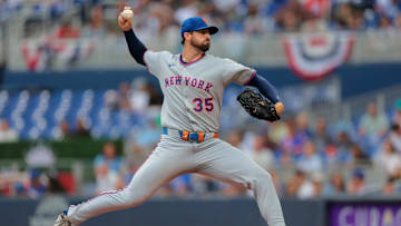 Apr 2, 2025; Miami, Florida, USA; New York Mets starting pitcher Clay Holmes (35) delivers a pitch against the Miami Marlins during the first inning at loanDepot Park. Mandatory Credit: Sam Navarro-Imagn Images