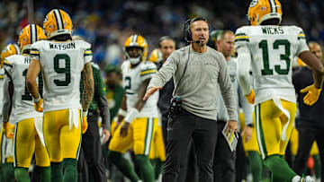 Green Bay Packers head coach Matt LaFleur slaps hands with players after the offense scores a touchdown against the Detroit Lions, during the Thursday Night Football at Ford Field in Detroit on Thursday, Dec. 5, 2024.
