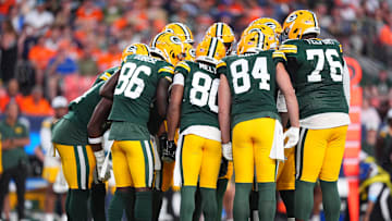 Aug 18, 2024; Denver, Colorado, USA; Members of the Green Bay Packers huddle in the first quarter against the Denver Broncos  at Empower Field at Mile High. Mandatory Credit: Ron Chenoy-Imagn Images