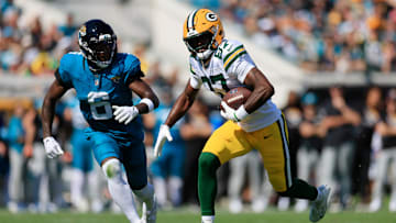 Green Bay Packers wide receiver Romeo Doubs (87) rushes for yards against Jacksonville Jaguars safety Darnell Savage (6) during the first quarter of an NFL football matchup Sunday, Oct. 27, 2024 at EverBank Stadium in Jacksonville, Fla.