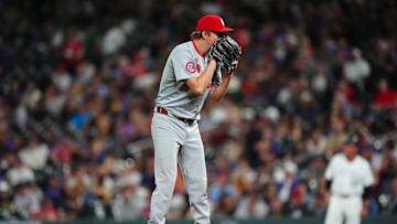 Sep 25, 2024; Denver, Colorado, USA; St. Louis Cardinals starting pitcher Erick Fedde (12) prepares to pitch in the fifth inning against the Colorado Rockies at Coors Field. Mandatory Credit: Ron Chenoy-Imagn Images
