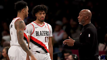 Feb 28, 2025; Brooklyn, New York, USA; Portland Trail Blazers head coach Chauncey Billups talks to guards Anfernee Simons (1) and Shaedon Sharpe (17) during the first quarter against the Brooklyn Nets at Barclays Center. Mandatory Credit: Brad Penner-Imagn Images
