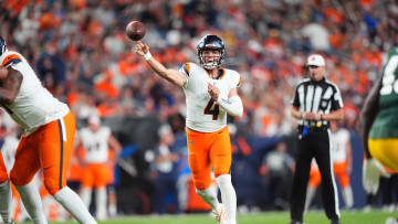 Aug 18, 2024; Denver, Colorado, USA; Denver Broncos quarterback Zach Wilson (4) passes the ball in the second half against the Green Bay Packers at Empower Field at Mile High. Mandatory Credit: Ron Chenoy-USA TODAY Sports