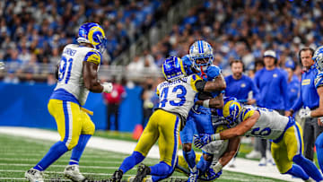 Detroit Lions wide receiver Jameson Williams (9) is tackled by Los Angeles Rams safety John Johnson III (43) and Los Angeles Rams linebacker Christian Rozeboom (56) after making a catch during the first half of the Detroit Lions season opener against the Los Angeles Rams at Ford Field in Detroit, on Sunday, Sept. 8. 2024.
