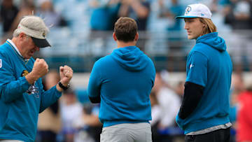 Jacksonville Jaguars quarterback Trevor Lawrence (16), from right, talks with offensive coordinator Press Taylor as Jacksonville Jaguars head coach Doug Pederson reacts before an NFL football matchup Sunday, Dec. 15, 2024 at EverBank Stadium in Jacksonville, Fla. 