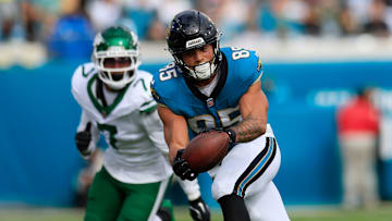Jacksonville Jaguars tight end Brenton Strange (85) hauls in a reception against New York Jets defensive end Haason Reddick (7) during the first quarter Sunday, Dec. 15, 2024 at EverBank Stadium in Jacksonville, Fla.