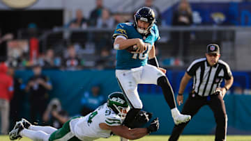 Jacksonville Jaguars quarterback Mac Jones (10) it brought down by Jacksonville Jaguars defensive tackle Maason Smith (94) during the fourth quarter Sunday, Dec. 15, 2024 at EverBank Stadium in Jacksonville, Fla. The Jets held off the Jaguars 32-25.