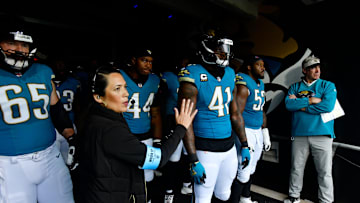 From left, Jacksonville Jaguars center Mitch Morse (65), defensive end Travon Walker (44), defensive end Josh Hines-Allen (41), defensive tackle DaVon Hamilton (52) and Jacksonville Jaguars head coach Doug Pederson wait to run on the field before an NFL football matchup Sunday, Dec. 15, 2024 at EverBank Stadium in Jacksonville, Fla.