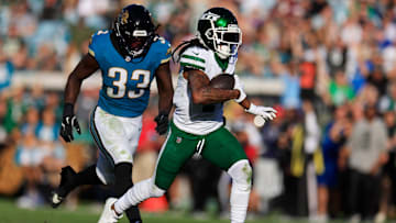 New York Jets wide receiver Davante Adams (17) scores a game-winning touchdown against Jacksonville Jaguars linebacker Devin Lloyd (33) during the fourth quarter Sunday, Dec. 15, 2024 at EverBank Stadium in Jacksonville, Fla. The Jets held off the Jaguars 32-25. [Corey Perrine/Florida Times-Union]