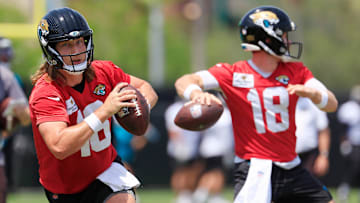 Jacksonville Jaguars quarterback Trevor Lawrence (16) looks to throw next to quarterback John Wolford (18) during the first organized team activity at Miller Electric Center Monday, May 19, 2025 in Jacksonville, Fla.
