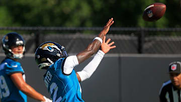 Jacksonville Jaguars wide receiver Travis Hunter (12) catches a pass as wide receiver Louis Rees-Zammit (89) looks on during the second mandatory minicamp at Miller Electric Center Wednesday, June 11, 2025 in Jacksonville, Fla.