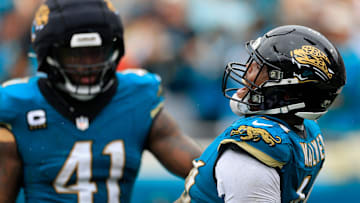 Jacksonville Jaguars defensive end Travon Walker (44) reacts to forcing a fumble with defensive end Josh Hines-Allen (41) during the second quarter of an NFL football matchup Sunday, Oct. 6, 2024 at EverBank Stadium in Jacksonville, Fla. 