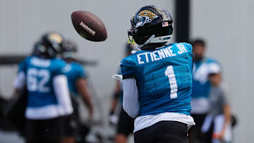 Jacksonville Jaguars running back Travis Etienne Jr. (1) hauls in a reception during an NFL training camp session at the Miller Electric Center, Friday, July 25, 2025, in Jacksonville, Fla. [Corey Perrine/Florida Times-Union]