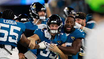 Jacksonville Jaguars place kicker Cam Little (39) is celebrated for his 70-yard field goal by cornerback Jarrian Jones (22) and others during the second quarter of an NFL preseason matchup at EverBank Stadium, Saturday, Aug. 9, 2025 in Jacksonville, Fla. [Corey Perrine/Florida Times-Union]