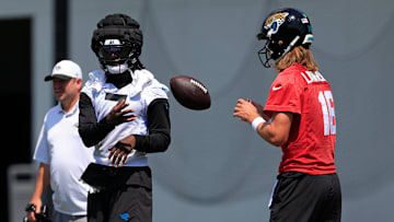 Jacksonville Jaguars wide receiver Brian Thomas Jr. (7), left, tosses the ball to quarterback Trevor Lawrence (16) during an NFL training camp session at the Miller Electric Center, Friday Aug. 15, 2025 in Jacksonville, Fla. [Corey Perrine/Florida Times-Union]