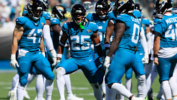 Jacksonville Jaguars safety Rayuan Lane III (25) reacts to his open field tackle on a kickoff return by Seattle Seahawks wide receiver Tory Horton (15) during the first quarter of an NFL football matchup, Sunday, Oct. 12, 2025, at EverBank Stadium in Jacksonville, Fla. The Seahawks defeated the Jaguars 20-12.