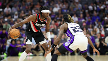 Oct 13, 2024; Sacramento, California, USA; Portland Trail Blazers forward Jerami Grant (9) controls the ball against Sacramento Kings guard Keon Ellis (23) during the first quarter at Golden 1 Center. Mandatory Credit: Sergio Estrada-Imagn Images