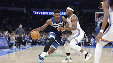 Feb 24, 2025; Oklahoma City, Oklahoma, USA; Minnesota Timberwolves guard Anthony Edwards (5) moves the ball down the court as Oklahoma City Thunder guard Luguentz Dort (5) defends during the second half at Paycom Center. Mandatory Credit: Alonzo Adams-Imagn Images
