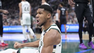 Milwaukee Bucks forward Giannis Antetokounmpo reacts after being fouled driving to the basket against the Brooklyn Nets in the first half at Fiserv Forum on January 2.